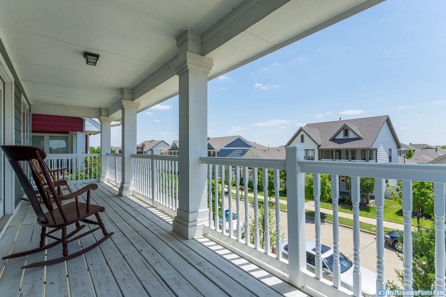Covered balcony with neighborhood views